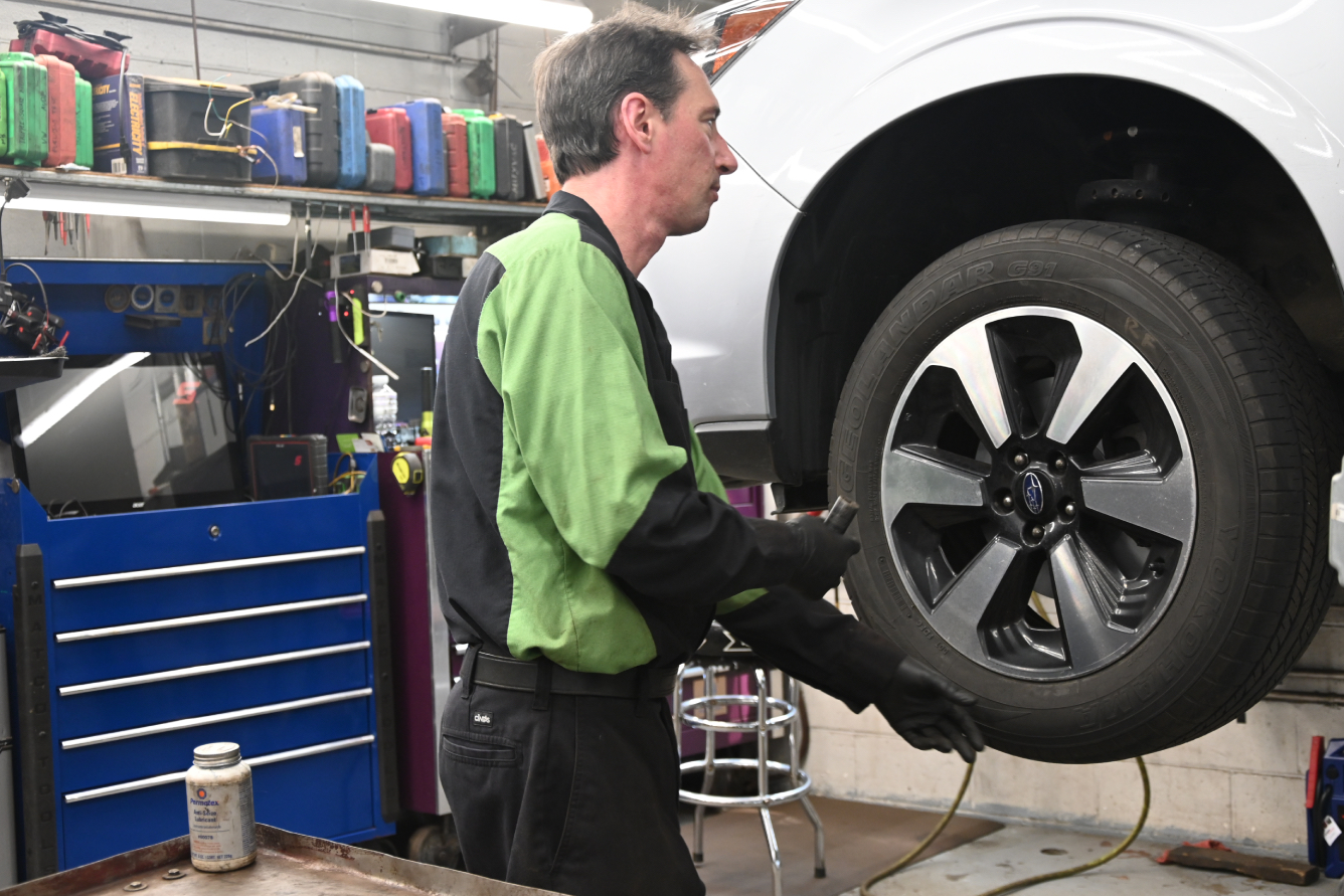 tire Co-op technician working on tires